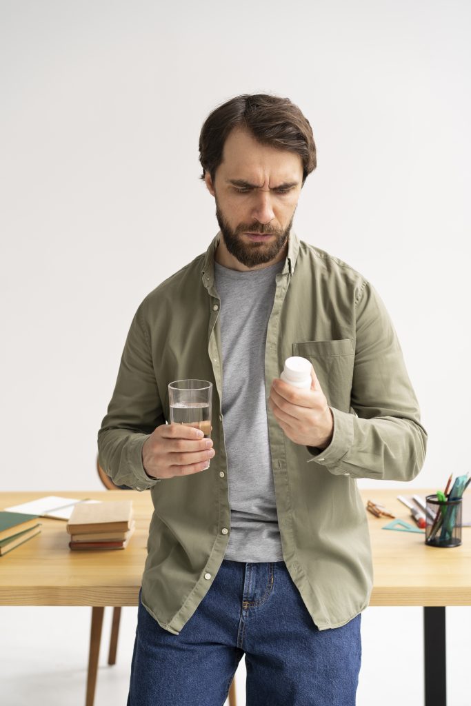 Patient taking laxatives as part of their piles medicine routine to prevent constipation.